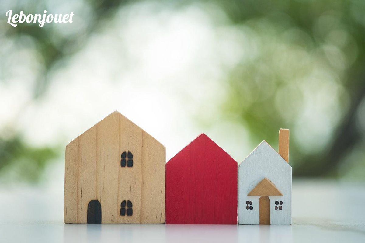 Petites maisons en bois colorées : la stratégie gagnante au Monopoly.